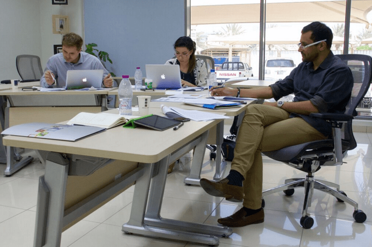 Zac Schroedl (left) and Scherry Bloul (middle) in a workshop with Al Jazeera presenter Kamahal Santamaria. 